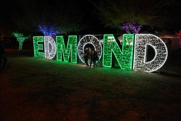 Enjoying Luminance, the walk-through holiday lights display in Edmond Dec 8. Photo by Heather Moery