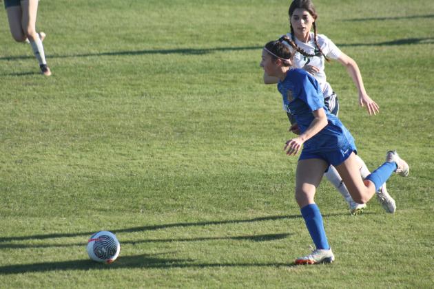 OCS' Izzy Martin dribbles down the field against Harding Charter Prep, Thursday, March 28. Taken by George McCormick.