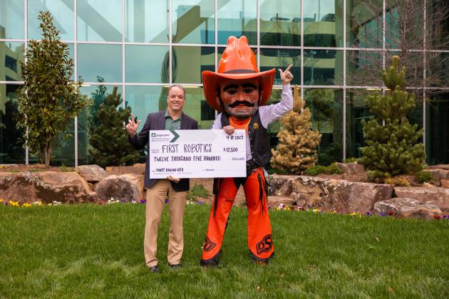 Brad Smith, Paycom Chief Information Officer and OSU Mascot Pistol Pete.