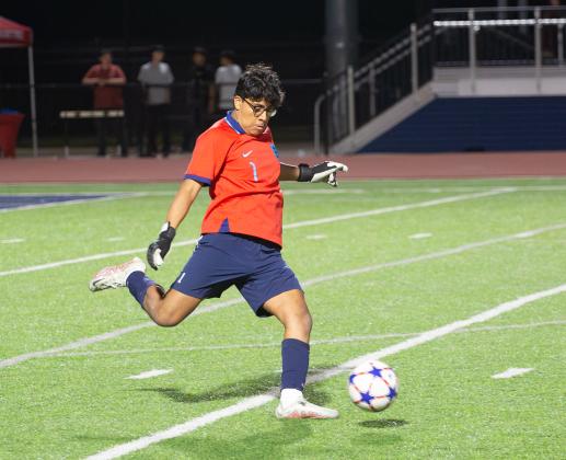 Edmond North goalkeeper Jesus Ramirez returns a ball into play Friday night against Capitol Hill. Photo by Drew Harmon.