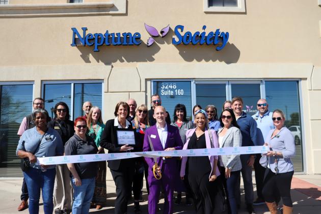 Neptune Society celebrates anniversary with ribbon cutting. 