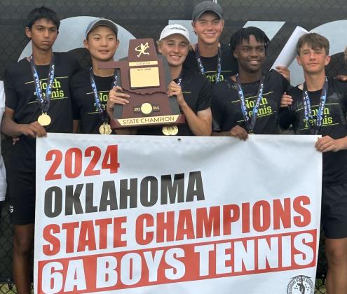 Edmond North boys tennis team poses with the 6A state championship trophy, Saturday, May 11. Courtesy of Edmond North athletics.