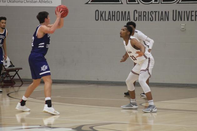 D.J. Walter (23) defends LCU's Ty Caswell (12)