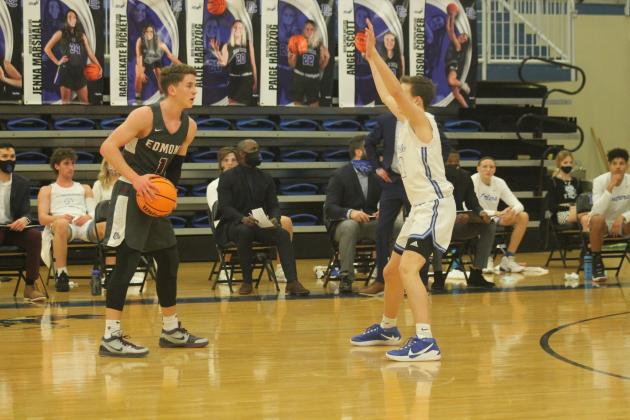 Sean Pedulla (1) is guarded by Hudson Linsenmeyer (21)