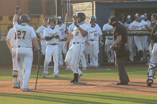 Kyle Crowl touches home plate after his second 3-run home run