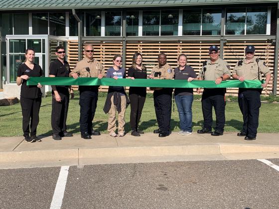 Edmond animal shelter staff participate in a ribbon cutting ceremony.