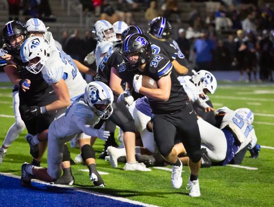 Deer Creek running back Mason Miller crosses the goal line for a touchdown in the win over Bartlesville on Friday night. Photo by Drew Harmon.
