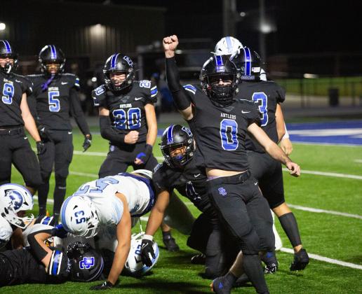 Deer Creek defenders including Z Green (0) celebrate a fourth-down stop in the win over Bartlesville on Friday night. Photo by Drew Harmon