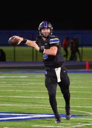 Deer Creek's Grady Adamson throws a pass in the win over Bartlesville on Friday night. Photo by Drew Harmon.