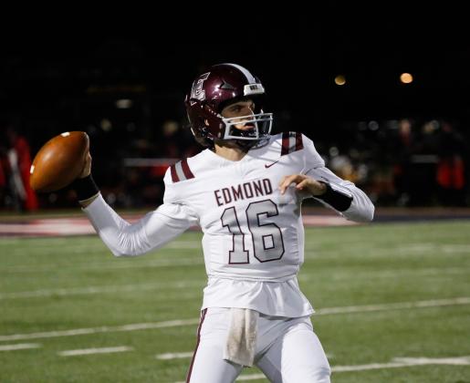 Edmond Memorial quarterback David McComb throws a pass against Mustang on Friday, Nov. 3
