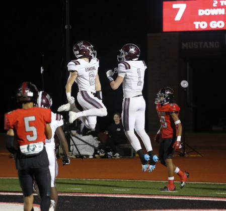 Edmond Memorial's Ciaran Pedulla (1) and Dillon Stidwell (2) celebrate a touchdown against Mustang on Friday, Nov. 3. 