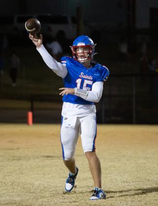 Oklahoma Christian School QB Garret Wilson throws a pass in the Saints' first-round playoff loss to Meeker on Friday night. Photo by Drew Harmon.