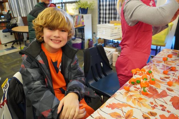 Second grader Wyatt Yocum shows off his fun fall craft