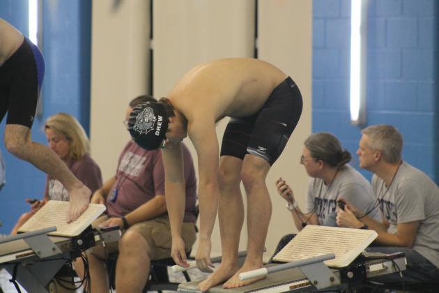 Edmond Memorial's Andrew Burgess warms up for a race at the team's Dec. 14 swim meet at Mitch Park. Taken by George McCormick.