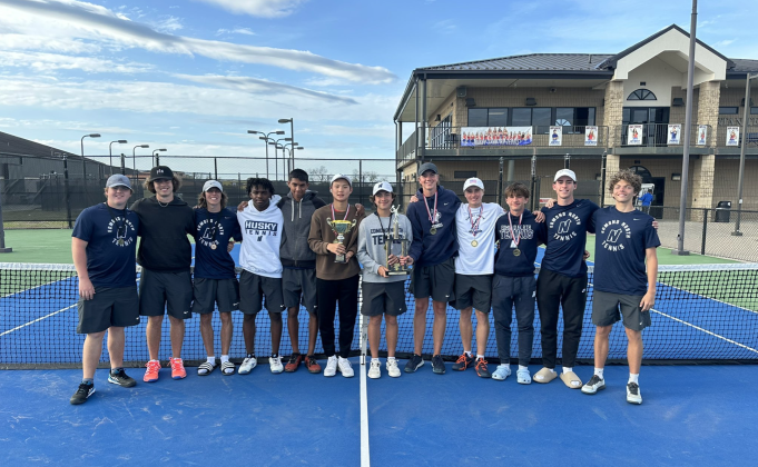Edmond North boys' tennis team poses for a photo with the Tiger Classic championship trophy, Tuesday, April 9. Courtesy of Edmond North athletics.