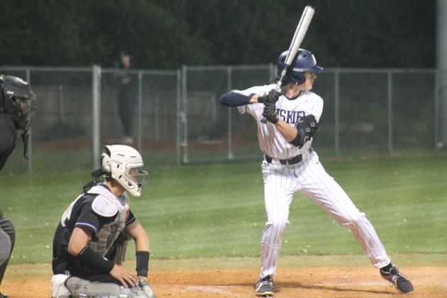 Edmond North's Paxton McClain up to bat with Deer Creek's Shane Smith catching. Monday, April 16. Taken by George McCormick.