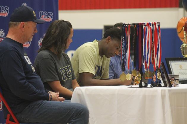 OCS' Luke Gray signs his Letter of Intent to Oral Roberts University, Wednesday, April 17. Photo by George McCormick.