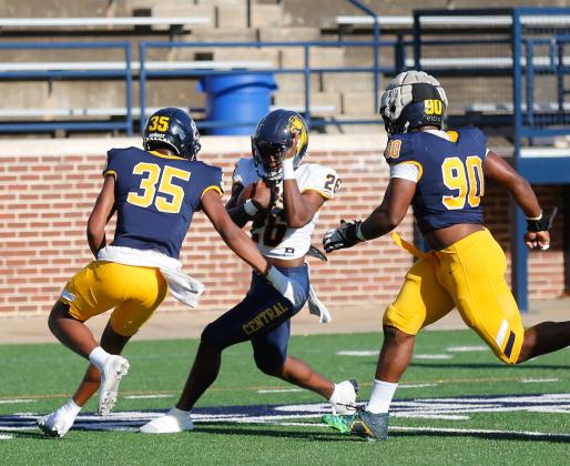 UCO defenders Daevion Hill (35) and Lemuel Gordon (90) close in on running back Ma’Lek Murphy (26) during the Bronchos’ spring game on Saturday. Photo by Drew Harmon.