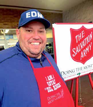 Rotary Club of Edmond president, Chris Berry rings a bell for The Salvation Army’s annual kettle drive at the I-35 Walmart in Edmond on December 13..
