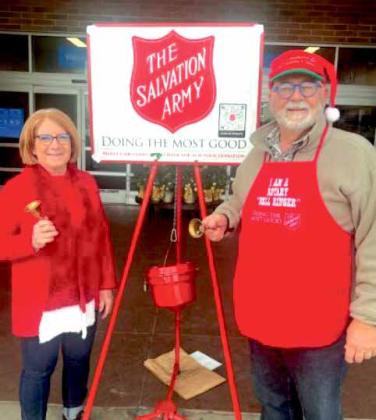 Rotary Club of Edmond members, Kathy Reeser and Randy Taylor ring bells for The Salvation Army’s annual kettle drive at the I-35 Walmart in Edmond on December 13.
