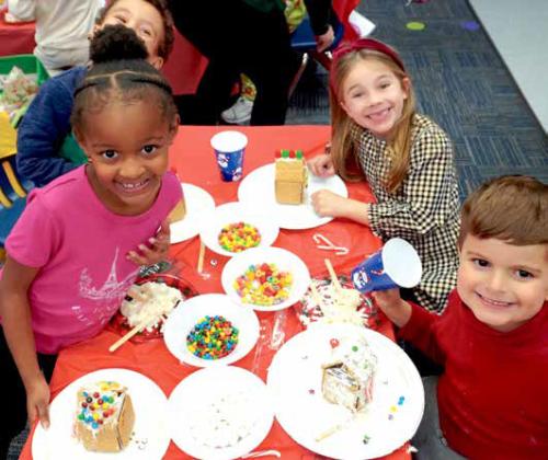Kindergarteners from Northern Hills Elementary School in Edmond made gingerbread houses last week in celebration of the holiday season. Check out the photo gallery online www.theedmondway. com of kindergarteners making (and eating) their gingerbread houses. Photos By Heather Moery